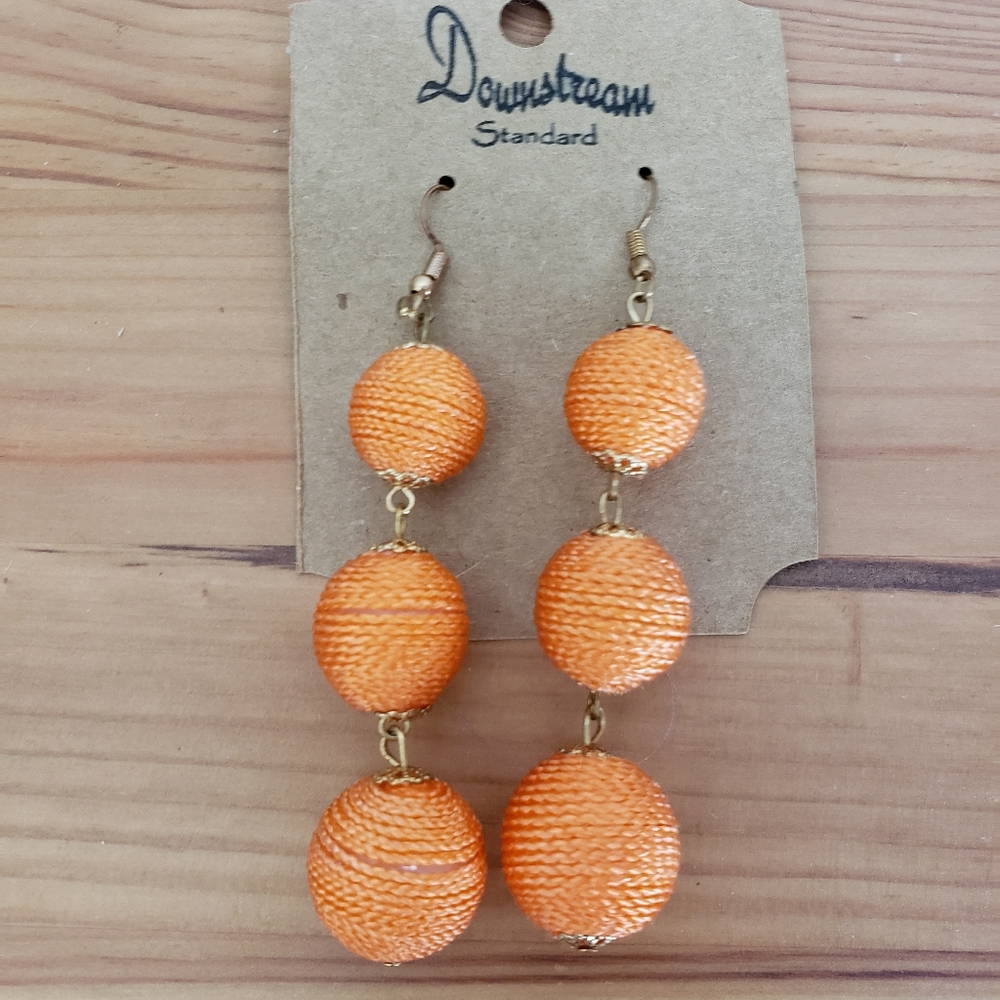 Orange ball drop earrings